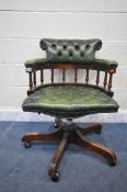 A REPRODUCTION MAHOGANY FRAMED CAPTAINS CHAIR, with buttoned green leather upholstery, width 64cm