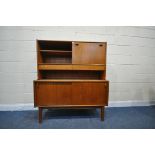 A MID CENTURY NATHAN TEAK HIGHBOARD, with an open bookcase section next to a fall front door,
