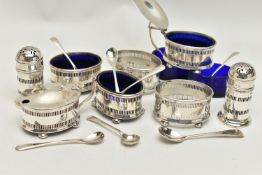 AN EIGHT PIECE SILVER CONDIMENT SET, comprising of four pierced salts each on four ball feet with