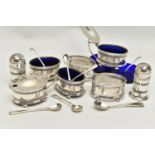 AN EIGHT PIECE SILVER CONDIMENT SET, comprising of four pierced salts each on four ball feet with