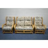 A WICKER FRAMED THREE PIECE CONSERVATORY SUITE, comprising a two seater sofa and two chairs, width