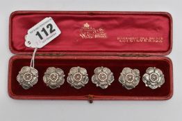 A CASED SET OF SIX EDWARDIAN SILVER BUTTONS IN THE FORM OF A FLOWERHEAD, makers Goldsmiths &