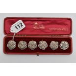 A CASED SET OF SIX EDWARDIAN SILVER BUTTONS IN THE FORM OF A FLOWERHEAD, makers Goldsmiths &