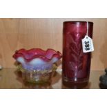 TWO PIECES OF CRANBERRY GLASS, to include a cylindrical vase etched with leaves, signed '(Jonathan?)