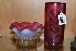 TWO PIECES OF CRANBERRY GLASS, to include a cylindrical vase etched with leaves, signed '(Jonathan?)