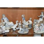 A LARGE COLLECTION OF LLADRO NAO FIGURES, comprising a 'Seated girl with goat' (broken and reglued