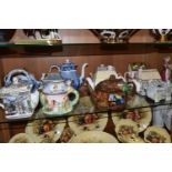 TWELVE TEAPOTS, mostly late twentieth century/contemporary novelty examples, to include Sadler
