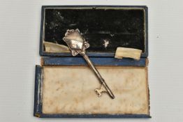 A CASED GEORGE V SILVER PRESENTATION KEY, engraved ' PRESENTED TO MRS W.E. SANGSTER ROUPELL PARK