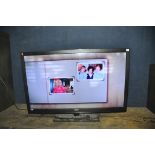 A BUSH LE55GB2A 55in TV on stand (no remote) (PAT pass and working) (Condition Base is slightly