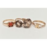 FOUR 9CT GOLD RINGS, to include a coral set signet ring, two smoky quartz set rings, and an