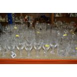 A COLLECTION OF CUT CRYSTAL, all of a similar pattern comprising a set of six white wine glasses,
