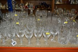 A COLLECTION OF CUT CRYSTAL, all of a similar pattern comprising a set of six white wine glasses,