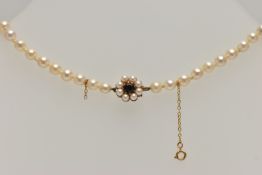 A CULTURED PEARL NECKLACE, single row of cultured cream pearls, each measuring approximately 6.