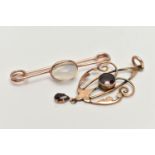 AN EARLY 20TH CENTURY LAVALIER PENDANT AND A BROOCH, rose metal open work lavalier pendant set