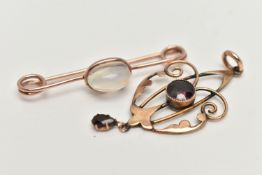 AN EARLY 20TH CENTURY LAVALIER PENDANT AND A BROOCH, rose metal open work lavalier pendant set