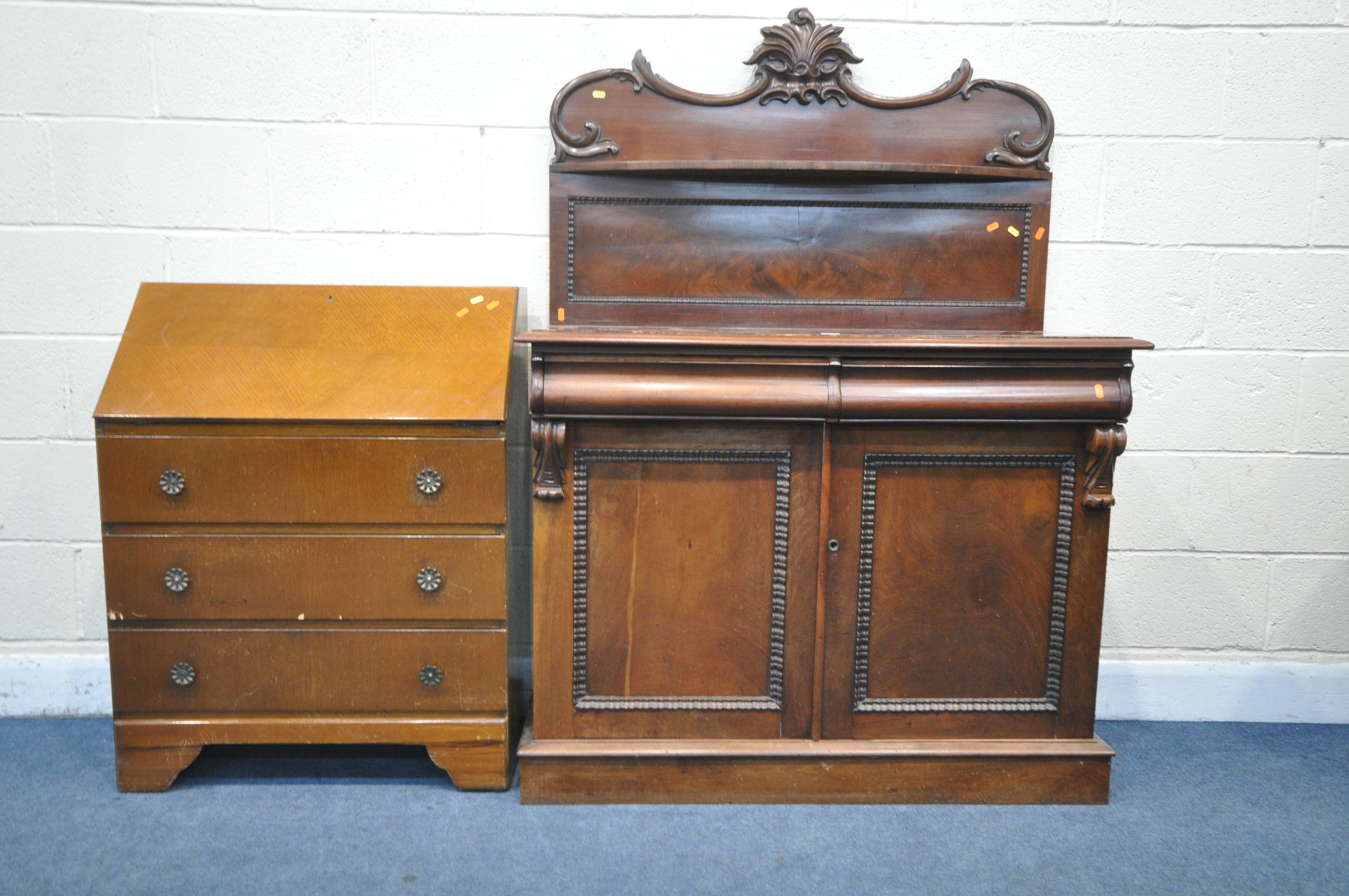 A VICTORIAN MAHOGANY CHIFFONIER, the raised back with scrolled foliate details and a single shelf,