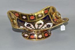 A ROYAL CROWN DERBY TWIN HANDLED BASKET, in Old Imari 1128 pattern with solid gold band, of