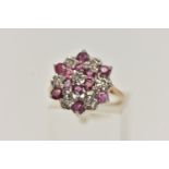 A 9CT GOLD RUBY AND DIAMOND CLUSTER RING, designed as a tiered cluster of single cut diamonds and