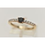 A DIAMOND RING, designed as a central brilliant cut treated black diamond in a four claw setting
