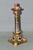 A ROYAL CROWN DERBY OLD IMARI 1128 SOLID GOLD BAND CANDLESTICK, heavily gilded with dolphin detail