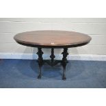 A LATE 19TH/EARLY 20TH CENTURY OVAL CENTRE TABLE, the mahogany top on an ebonised base, with