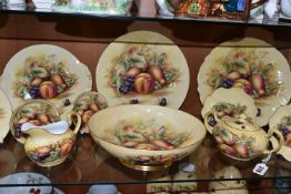 ELEVEN PIECES OF AYNSLEY ORCHARD GOLD TEA AND DINNER WARES, comprising a footed fruit/salad bowl,