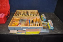 A BESPOKE WOODEN CABINET CONTAINING CHISELS AND GOUGES by Marple’s and other makers along with six