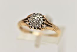 A YELLOW METAL DIAMOND CLUSTER RING, small circular cluster of single cut diamonds, within an