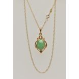 A GEM SET PENDANT AND CHAIN, the oval jade cabochon in a four claw setting with a scrolling
