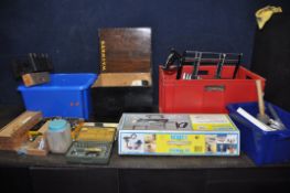 FOUR PLASTIC BOXES CONTAINING TOOLS including paint and pasting brushes, two mitre saws, a mitre