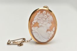 A CAMEO BROOCH PENDANT, oval shell cameo depicting a ladys profile, collet set in yellow metal,