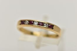 AN 18CT GOLD RUBY AND DIAMOND SEVEN STONE RING, designed as four circular rubies interspaced by