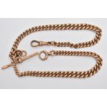 AN EARLY 20TH CENTURY 9CT GOLD ALBERT CHAIN, a rose gold graduated curb link chain, fitted with a
