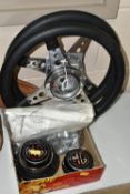 TWO VINTAGE M.G STEERING WHEELS, made by Moto-Lita, with M.G centre pieces (1 box + loose)