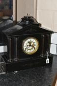 A 19TH CENTURY BLACK SLATE MANTEL CLOCK, architectural form, with four columns to the front, gilt