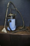 A NUMATIC CT-470-2 WET AND DRY VACUUM CLEANER with pipework and wet head (PAT pass and working but