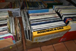 THREE BOXES OF OVER TWO HUNDRED L.P RECORDS, artists include Boy George, Eagles, Whitney Houston,