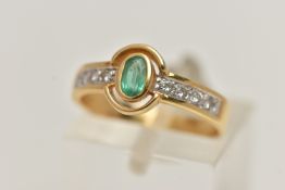 AN 18CT GOLD EMERALD AND DIAMOND RING, designed as a central oval emerald flanked by brilliant cut