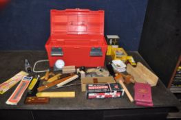 A PLASTIC TOOLBOX CONTAINING CARPENTRY TOOLS including a Woden X190 dowelling jig, a Record No0110