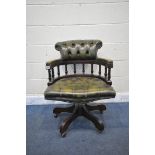 A REPRODUCTION MAHOGANY CAPTAINS CHAIR, with buttoned green leather upholstery (condition -