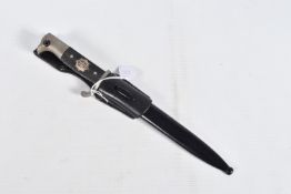 A GERMAN MILITARY DRESS DAGGER, the blade and scabbard are in good condition and it also has a
