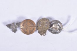 FOUR NAZI GERMANY PIN BADGES, these include a third Reich Turnerland membership badge, a small RDB