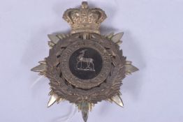 EARLY TWENTIETH CENTURY ROYAL WARWICKSHIRE HELMET PLATE, this features the antelope on a black