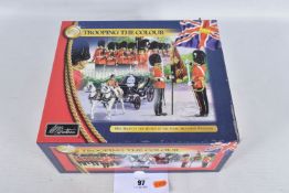 A BOXED COLLECTORS W BRITAIN TROOPING THE COLOUR HER MAGESTY THE QUEEN IN THE IVORY MOUNTED