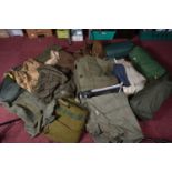 A LARGE AMOUNT OF ARMY CAMPING AND CAMOUFLAGE CLOTHING, this includes three jackets, trousers, three