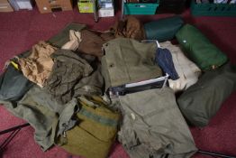 A LARGE AMOUNT OF ARMY CAMPING AND CAMOUFLAGE CLOTHING, this includes three jackets, trousers, three