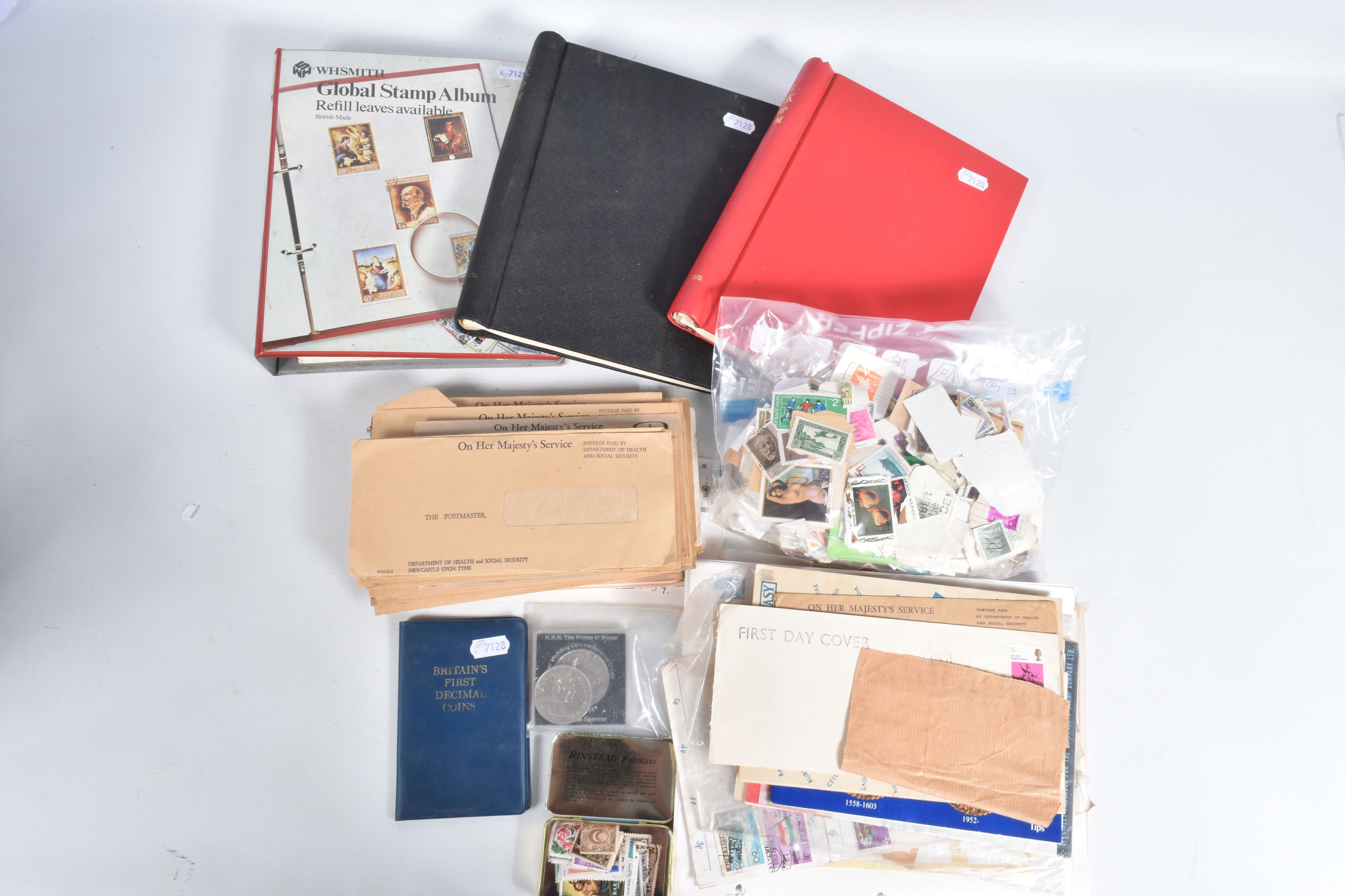 SMALL BOX OF STAMPS IN THREE ALBUMS AND LOOSE IN PACKETS INCLUDING SOME MINT GB DECIMAL