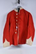 A PRE WWI STYLE BRITISH ARMY TUNIC, this is scarlet red in colour and still has the remains on the