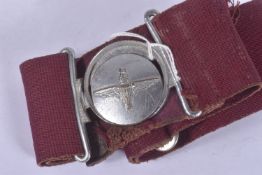 A PARATROOP REGIMENT STABLE BELT AND BUCKLE, the belt is purple in colour and the reverse of the