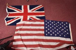 A WWI 1916 DATED UNION JACK FLAG AND A LATER USA FLAG, the Union Jack flag has the broad arrow and